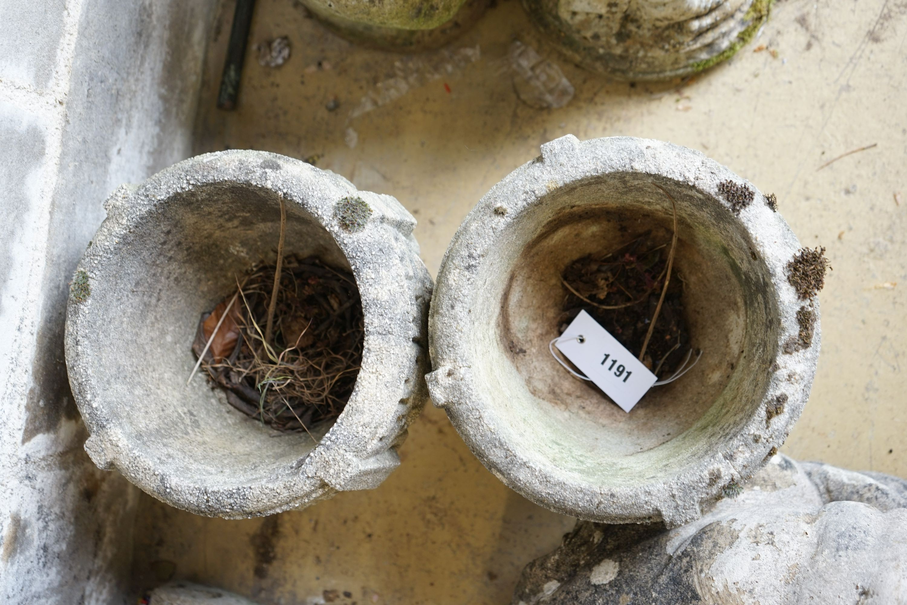 A pair of circular reconstituted garden planters, diameter 22cm